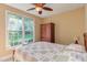 Cozy bedroom with natural light, wood furniture, and relaxing atmosphere at 2012 Silverleaf Dr, Youngsville, NC 27596