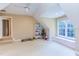 Large bonus room bedroom with a ceiling fan, a large window seat, and toys at 2012 Silverleaf Dr, Youngsville, NC 27596