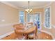 Cozy dining room featuring a wooden table and chairs beneath an elegant chandelier at 2012 Silverleaf Dr, Youngsville, NC 27596