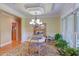 Cozy dining room with wainscoting, chandelier, and views to the outside at 2012 Silverleaf Dr, Youngsville, NC 27596