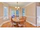 Sunny breakfast nook with a table and chairs, bay windows, and hardwood floors at 2012 Silverleaf Dr, Youngsville, NC 27596