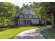 Beautiful two-story home with lush landscaping and a curved driveway leading to the entrance at 2012 Silverleaf Dr, Youngsville, NC 27596
