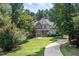 Charming home with a well-manicured lawn and a gracefully curving walkway leading to the front door at 2012 Silverleaf Dr, Youngsville, NC 27596