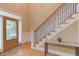 Elegant foyer with hardwood floors, staircase, and decorative console table at 2012 Silverleaf Dr, Youngsville, NC 27596