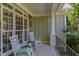 Cozy front porch featuring rocking chairs and ample natural light through large windows at 2012 Silverleaf Dr, Youngsville, NC 27596