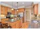 Well-equipped kitchen featuring wooden cabinetry, stainless steel appliances, and a central island at 2012 Silverleaf Dr, Youngsville, NC 27596
