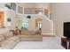 Open-concept living area with a staircase and views into other rooms through arched entryways at 2012 Silverleaf Dr, Youngsville, NC 27596
