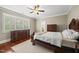 Bedroom featuring a bed, two dressers, and a neutral colored rug at 204 Edgepine Dr, Holly Springs, NC 27540