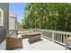 Outdoor deck featuring comfortable seating and lush greenery for serene relaxation at 204 Edgepine Dr, Holly Springs, NC 27540