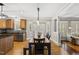 Open-concept dining room connected to the living room offering a cozy dining area with views at 204 Edgepine Dr, Holly Springs, NC 27540