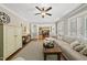 Cozy living room with fireplace that opens into a dining room, promoting connectivity at 204 Edgepine Dr, Holly Springs, NC 27540