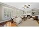 Bright and welcoming living room with a fireplace, plush sectional, and natural light at 204 Edgepine Dr, Holly Springs, NC 27540