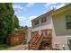 Back of home features a deck with stairs, windows and satellite dish at 25 Silver Pl # Apt B, Angier, NC 27501