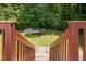 The backyard features a trampoline, offering fun and recreation in a lush outdoor setting at 25 Silver Pl # Apt B, Angier, NC 27501