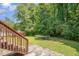 Trampoline in grassy backyard providing a recreational space at 25 Silver Pl # Apt B, Angier, NC 27501