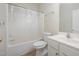 Clean bathroom featuring a shower-tub combo, toilet and sink with vanity at 25 Silver Pl # Apt B, Angier, NC 27501