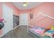 Bedroom features a chalkboard wall, closet doors, and a ceiling fan fixture at 25 Silver Pl # Apt B, Angier, NC 27501