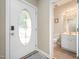 Bright entryway featuring a stylish front door and a convenient half-bathroom nearby at 25 Silver Pl # Apt B, Angier, NC 27501