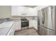 Bright kitchen with stainless steel appliances, white cabinets, and ample counter space at 25 Silver Pl # Apt B, Angier, NC 27501