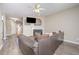 Cozy living room with hardwood floors, a fireplace, and a ceiling fan for added comfort at 25 Silver Pl # Apt B, Angier, NC 27501
