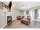 Inviting living room with a classic fireplace, comfortable seating, and natural light at 25 Silver Pl # Apt B, Angier, NC 27501