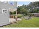 Landscaped backyard featuring a wooden deck and raised garden beds, perfect for outdoor enjoyment at 2503 Shirley St, Durham, NC 27705
