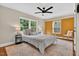 Bright bedroom features a ceiling fan, natural light, and calming earth tone decor at 2503 Shirley St, Durham, NC 27705