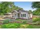 Charming home exterior featuring a cozy front porch, well-maintained landscaping and inviting stone walkway at 2503 Shirley St, Durham, NC 27705
