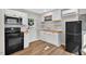 Modern kitchen with stainless steel appliances, butcher block counters, and bright lighting at 2503 Shirley St, Durham, NC 27705