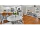 Bright kitchen with white cabinets, stainless steel appliances and a hardwood floor at 2503 Shirley St, Durham, NC 27705