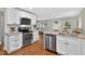 Well-equipped kitchen with granite countertops, stainless steel appliances, and stylish cabinetry at 2503 Shirley St, Durham, NC 27705