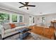 Cozy living room that opens to the kitchen with hardwood floors and lots of natural light at 2503 Shirley St, Durham, NC 27705