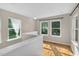 Loft with hardwood floors and large windows overlooking the green trees at 2503 Shirley St, Durham, NC 27705