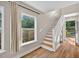 Bright staircase with hardwood treads, white risers, leading to second floor at 2503 Shirley St, Durham, NC 27705