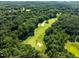 Overhead view of lush green golf course surrounded by trees at 2602 Vintage Hill Ct, Durham, NC 27712