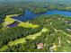 Stunning aerial view of golf course community, highlighting lush green fairways and picturesque homes at 2602 Vintage Hill Ct, Durham, NC 27712