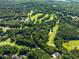 Overhead shot of golf course with homes and trees dotting the landscape at 2602 Vintage Hill Ct, Durham, NC 27712
