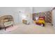 Bright bedroom with whimsical decor, featuring a patterned wall and unique seating at 2602 Vintage Hill Ct, Durham, NC 27712