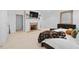 Spacious bedroom featuring a fireplace, white walls, and neutral carpet at 2602 Vintage Hill Ct, Durham, NC 27712