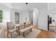 Bright dining area adjacent to kitchen featuring hardwood floors and lots of natural light at 2602 Vintage Hill Ct, Durham, NC 27712