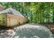 Long driveway leads to a three car garage surrounded by mature trees at 2602 Vintage Hill Ct, Durham, NC 27712