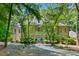 Stunning home features a grand facade, mature trees, and a manicured lawn at 2602 Vintage Hill Ct, Durham, NC 27712