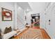 Elegant foyer with hardwood floors, staircase, and seating area, offering a warm welcome at 2602 Vintage Hill Ct, Durham, NC 27712
