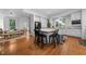 Open concept kitchen featuring hardwood floors, white cabinets, and stainless steel appliances at 2602 Vintage Hill Ct, Durham, NC 27712