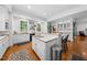 Stylish kitchen featuring a kitchen island, hardwood floors, and stainless steel appliances at 2602 Vintage Hill Ct, Durham, NC 27712