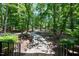 Beautiful landscaped grounds feature lush greenery and a curving walkway at 2602 Vintage Hill Ct, Durham, NC 27712