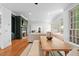 Open concept living area featuring hardwood floors, fireplace, and adjacent dining area at 2602 Vintage Hill Ct, Durham, NC 27712