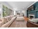 Bright living room with large windows, fireplace, and comfortable, oversized sectional sofa at 2602 Vintage Hill Ct, Durham, NC 27712