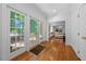 Entryway leading to a bright living room with hardwood floors and french doors to the yard at 2602 Vintage Hill Ct, Durham, NC 27712