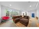Large living room with a sectional sofa, big windows, and comfortable seating at 2602 Vintage Hill Ct, Durham, NC 27712